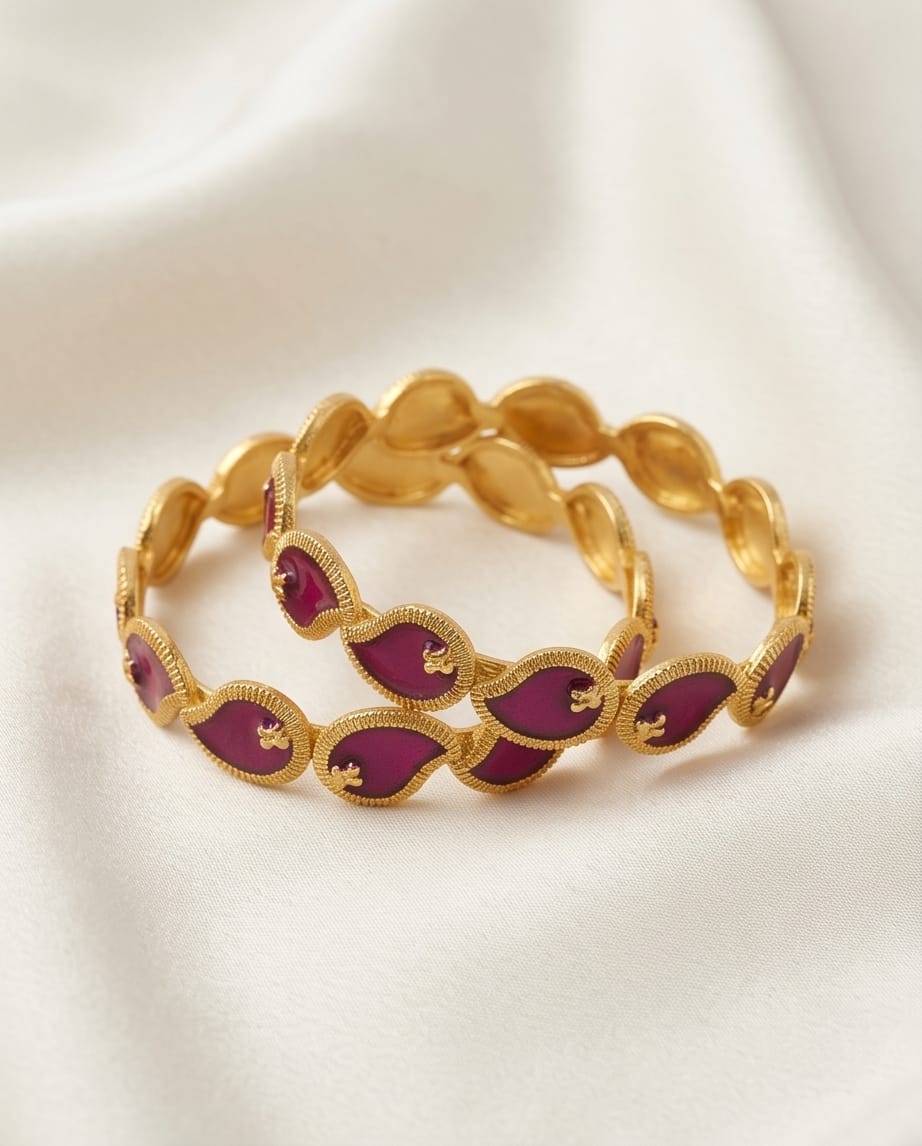 Gold bracelet with purple stones on a white background