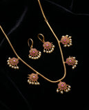 Jewelry set with necklace and earrings on a black background