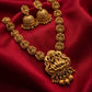 Gold necklace and earrings on a red fabric background